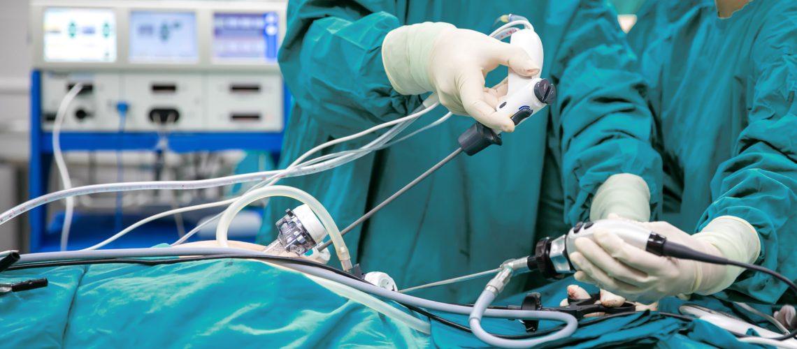 Surgeons team hands during laparoscopic abdominal operation in p